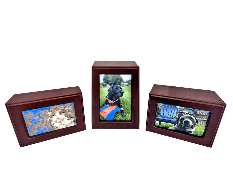 three redwood-finish photo urns, each with a pet's picture set into the front panel